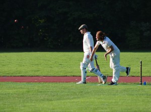 Hairy man Mahmoud Khan bowls while "cappy" Wembridge backs up © Philip Crebbin